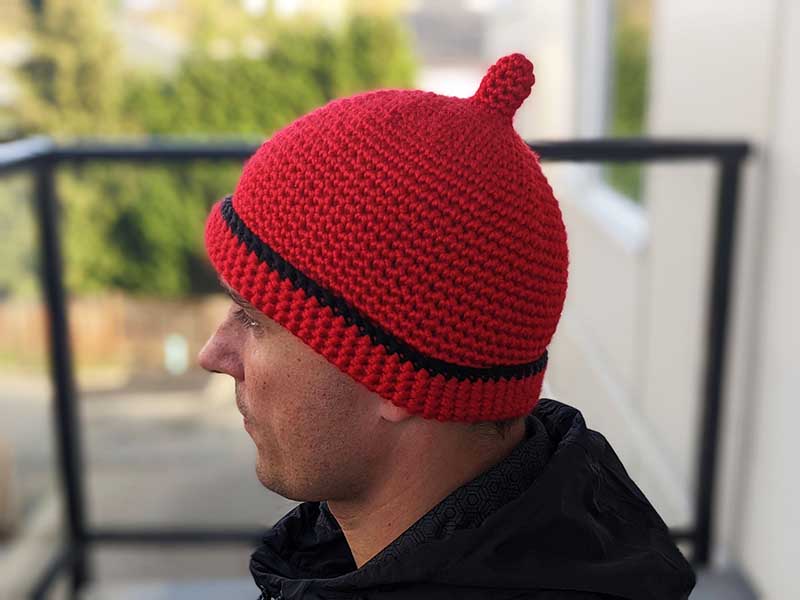 crochet teletubby hat on a male model - left-side view