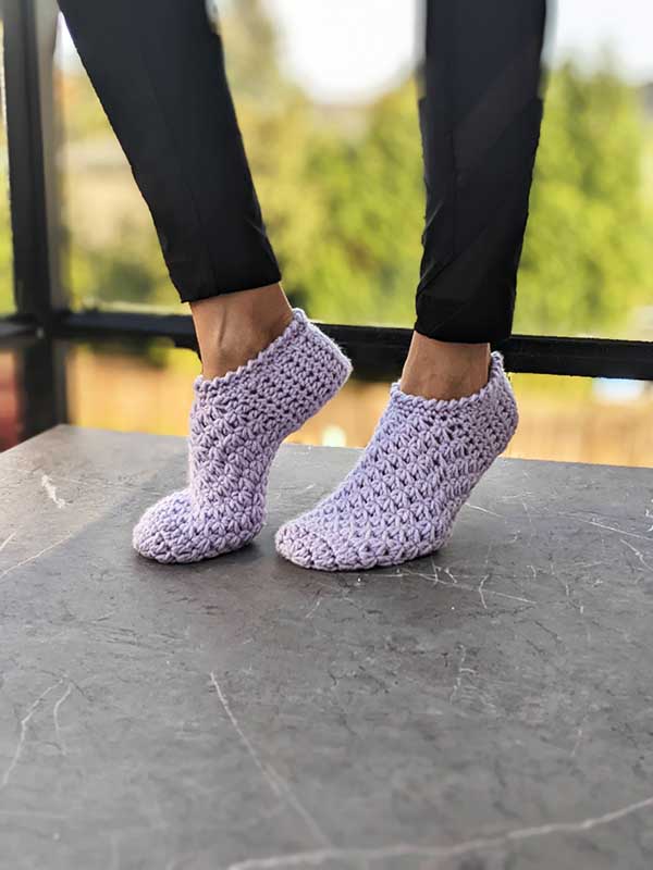 crochet soft house slippers on female model feet