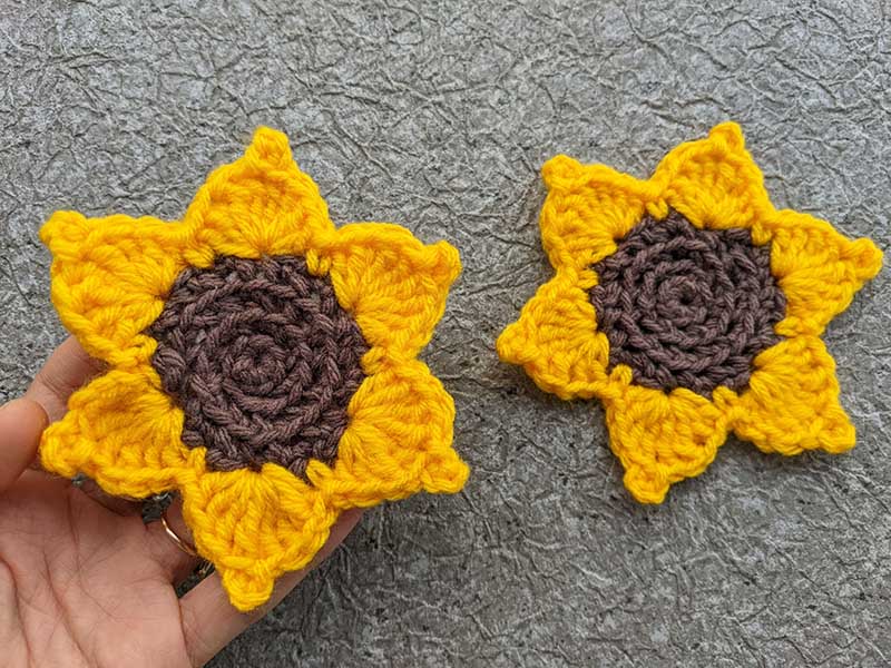 two crochet sunflower heads