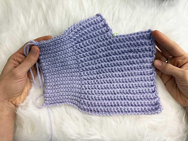 unfinished crochet ribbed fingerless glove - after the thumb section and before the assembly