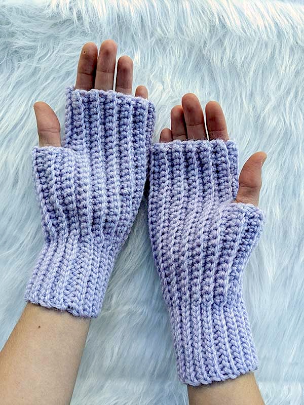crochet ribbed fingerless gloves shown on female hands