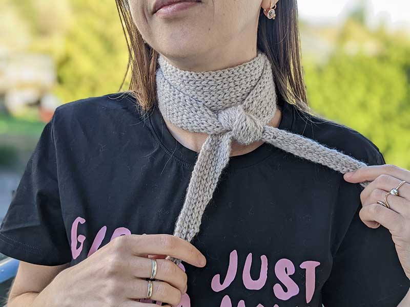 Crochet Sophie scarf tied around female model's neck
