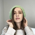 crochet french beret on a female model - front-side view