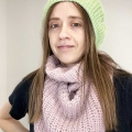 female model wears a crochet french beret and a knit baktus scarf
