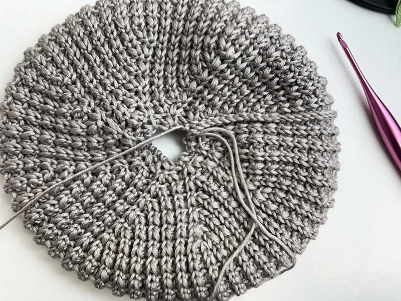 closing the crown hole of a crochet classic beret