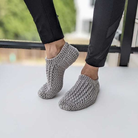 everyday crochet slippers on model feet - left side view
