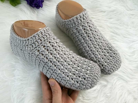 everyday crochet slippers on mannequin feet - close-up view