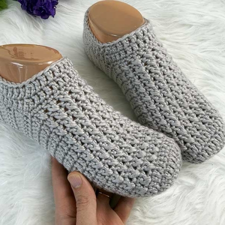 everyday crochet slippers on mannequin feet - close-up view