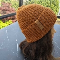 crochet casual unisex beanie on a female mannequin's head - right side view
