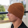 crochet casual unisex beanie on a male model's head - left side view