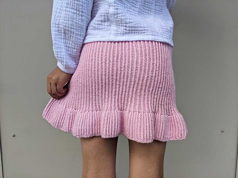 crochet summer skirt on a girl's model - back side view