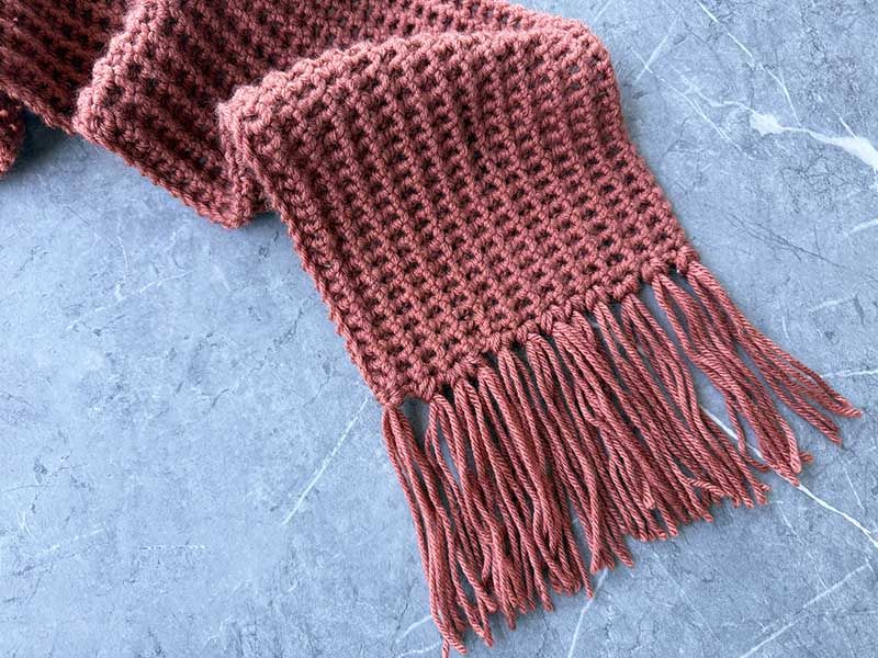 close-up view of the fringes made on a crochet one-stitch scarf for men
