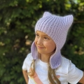 crochet kitty hat with earflaps on a girl model - left-side view